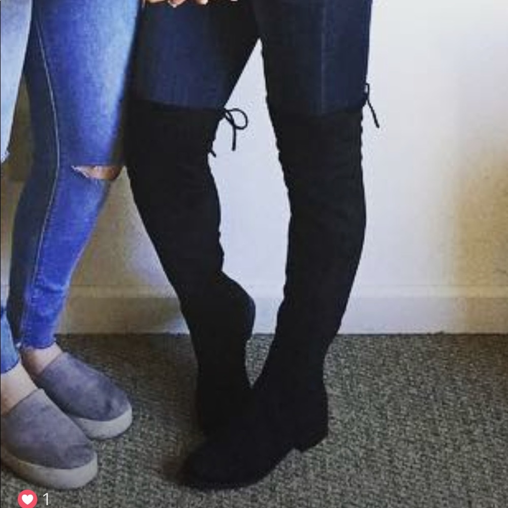 Tall black boots with ties
